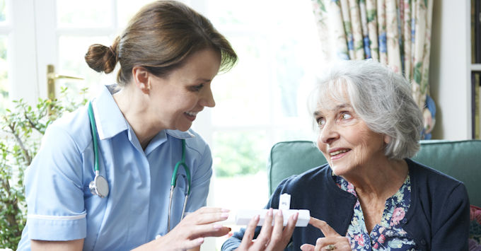 Nurse giving meds